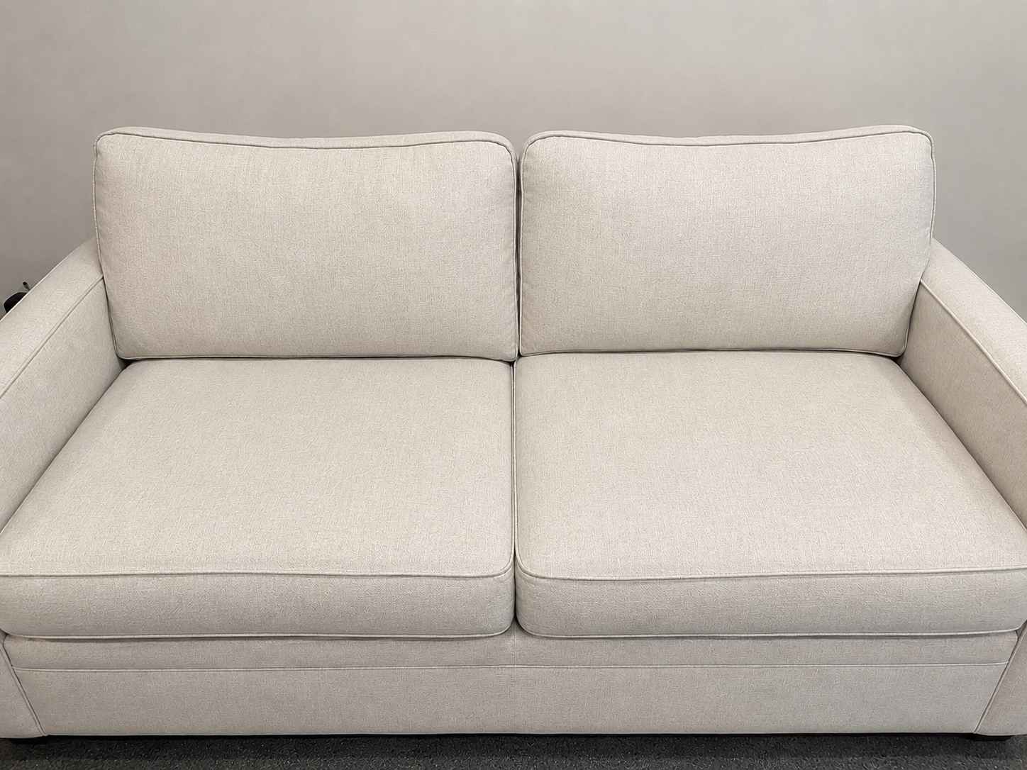 After professional upholstery cleaning - fresh, spotless sofa restored to like-new condition