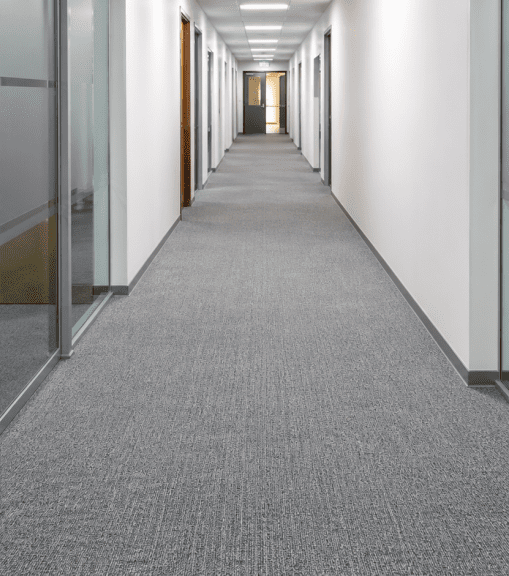 After commercial carpet cleaning - clean, uniform office carpet between workstations